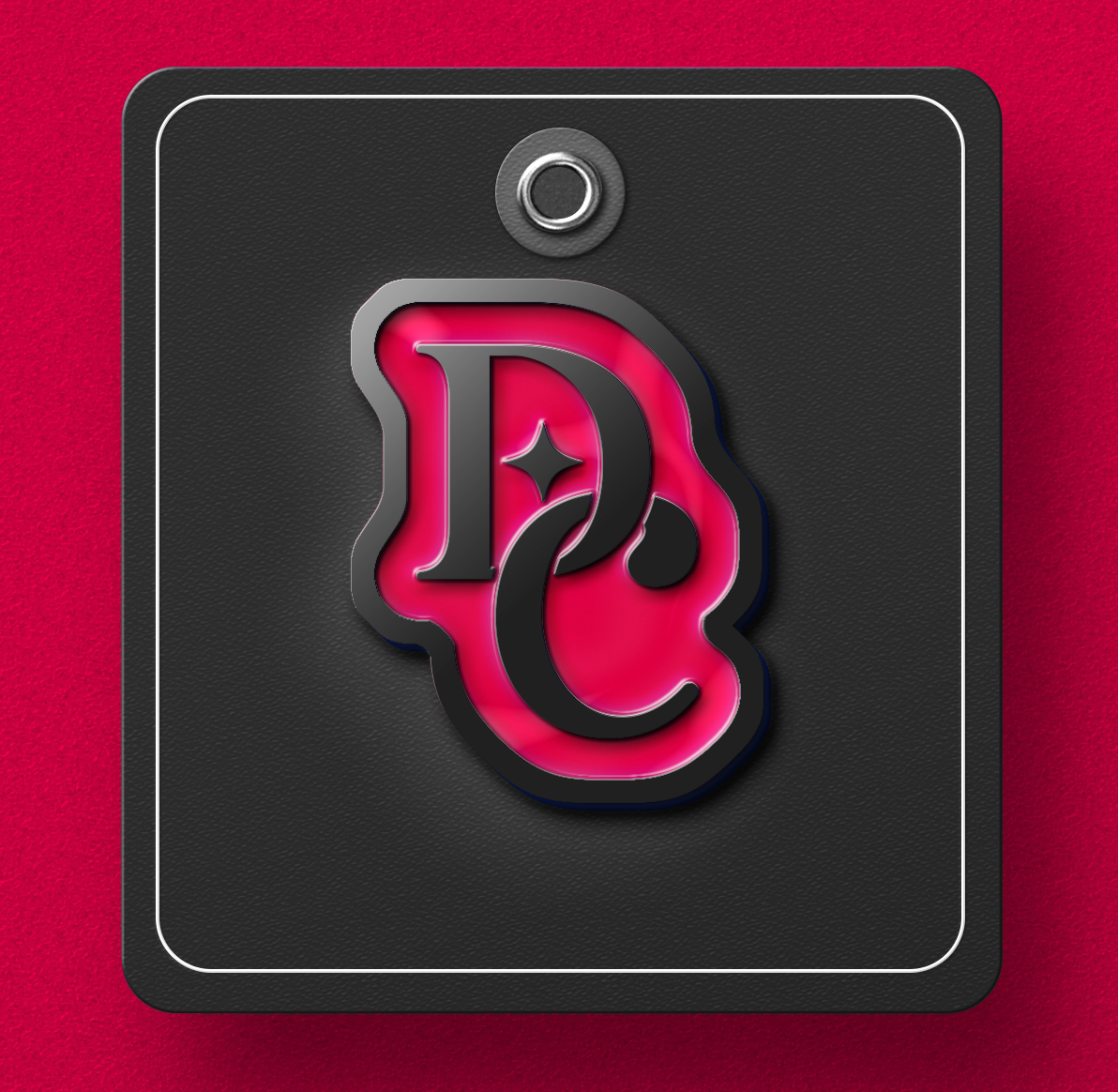 A logo mockup on an enamel pin. The logo has the letters DC and is red and black.