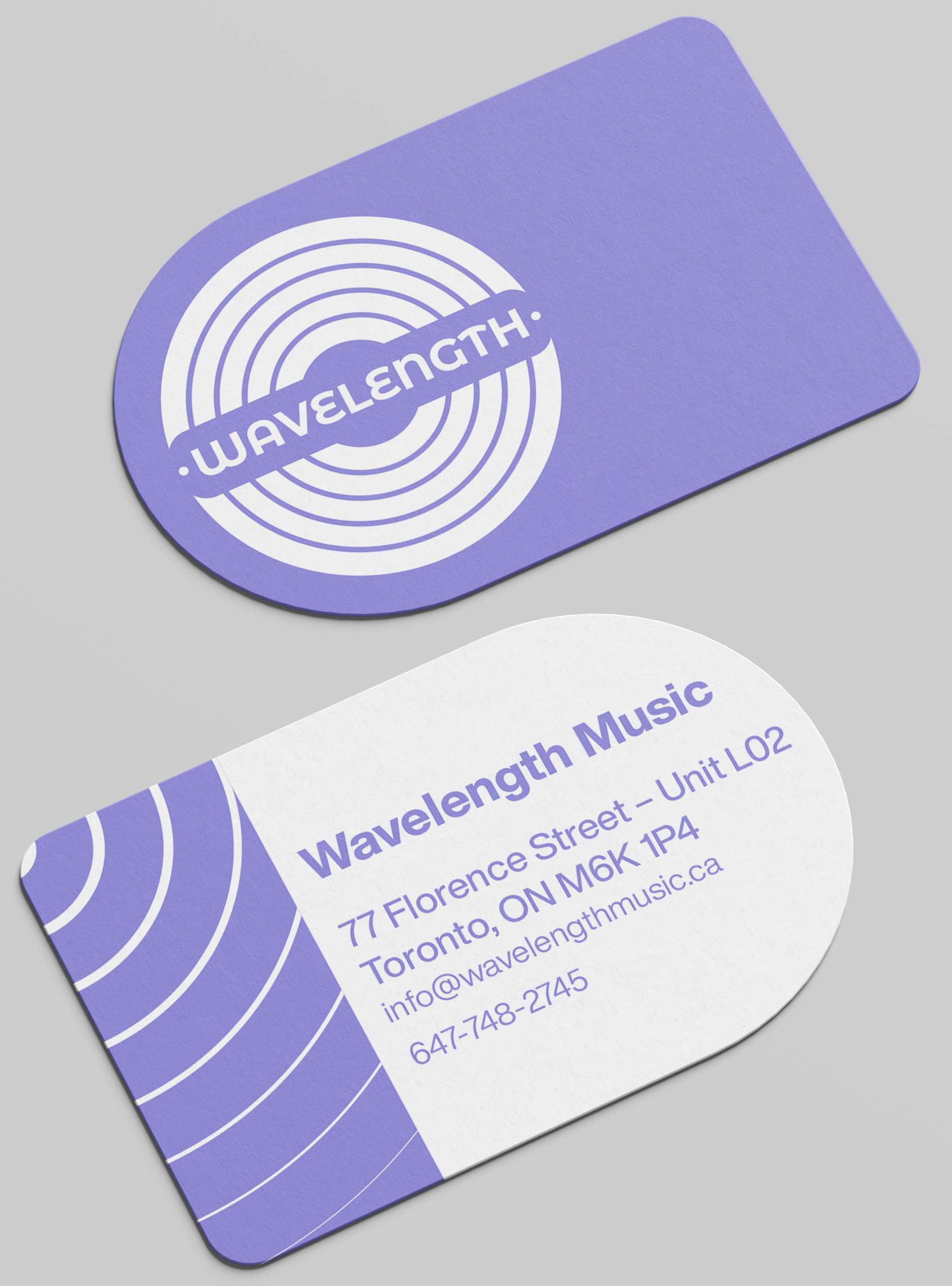 A logo mockup on a rounded business card. The logo is for Wavelength, and is purple.